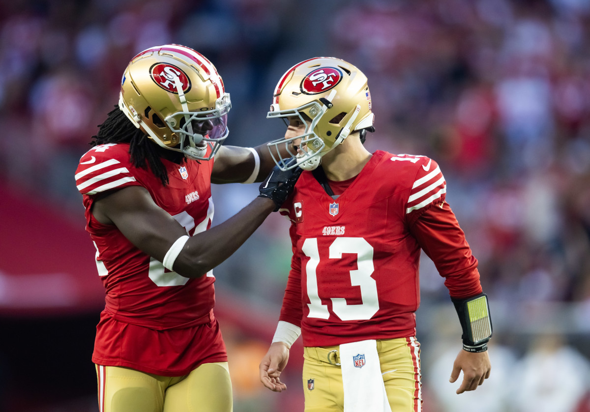 Chris Conley and Brock Purdy look at each other in celebration